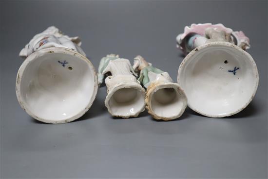 Two pairs of Continental porcelain figures of a man and woman, 15cm and 26cm